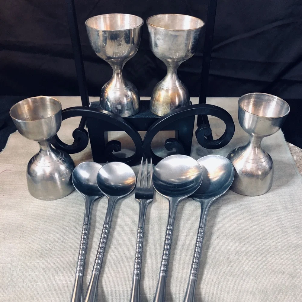 Set of Dansk Jette Stainless Steel flatware and / Four Stainless Steel Pegs